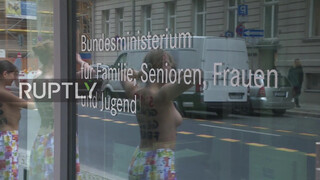 6. Germany: Topless Femen activists protest in front of federal ministry *EXPLICIT CONTENT*