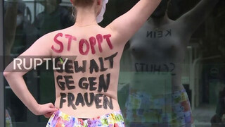 Germany: Topless Femen activists protest in front of federal ministry *EXPLICIT CONTENT*
