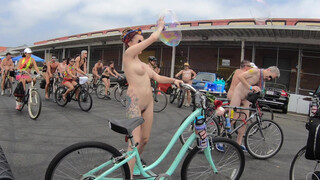 4. Bubbles Bikes and Breasts. Artist nude woman popping giant bubbles at the LA world naked bike ride.