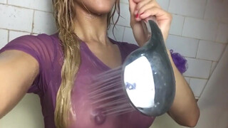8. Amazing girl in see through shirt in shower!