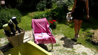 4. IN AN APRON ALONE IN HER GARDEN SOCOLA CLEANING HER BATH IN A BIKINI