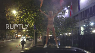 7. Ukraine: Half-naked FEMEN activist protests near Polish Embassy in Kiev *EXPLICIT*