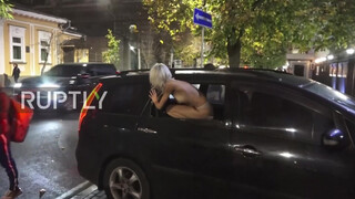 2. Ukraine: Half-naked FEMEN activist protests near Polish Embassy in Kiev *EXPLICIT*