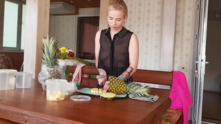 5. Pineapple cutting in black transparent shirt