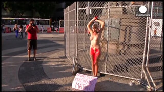 4. Chained naked to a fence, woman protests against sexism in Brazil