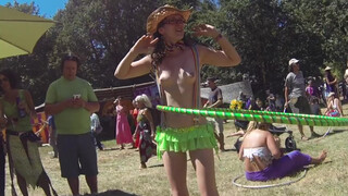 9. Topless Cowgirl Hippy with Lime Green Hula Hoop and Rave Skirt Enjoying the Sunny Day at a Festival