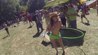 2. Topless Cowgirl Hippy with Lime Green Hula Hoop and Rave Skirt Enjoying the Sunny Day at a Festival