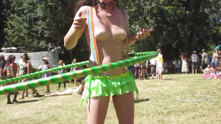 3. Topless Cowgirl Hippy with Lime Green Hula Hoop and Rave Skirt Enjoying the Sunny Day at a Festival