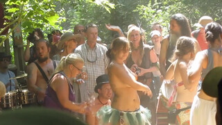 9. Topless and Body Painted Hippie at Drum Circle-oc