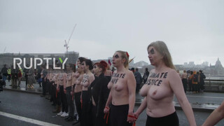 4. UK: Topless climate activists block London bridge with human chain on IWD *EXPLICIT*