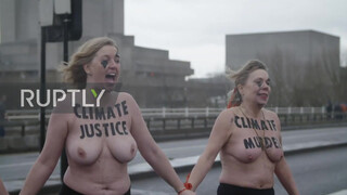 5. UK: Topless climate activists block London bridge with human chain on IWD *EXPLICIT*