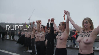 6. UK: Topless climate activists block London bridge with human chain on IWD *EXPLICIT*