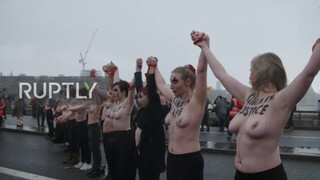 7. UK: Topless climate activists block London bridge with human chain on IWD *EXPLICIT*