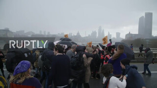 8. UK: Topless climate activists block London bridge with human chain on IWD *EXPLICIT*