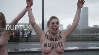 3. UK: Topless climate activists block London bridge with human chain on IWD *EXPLICIT*