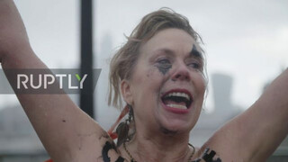 UK: Topless climate activists block London bridge with human chain on IWD *EXPLICIT*