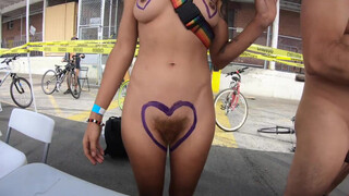 2. Triangle Heart Boobs. Body paint tent with nude artist who shows off her small tits and big bush.