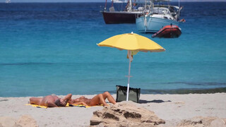8. Happy naked sunbathers in Spain