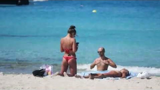 Happy naked sunbathers in Spain