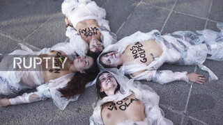 2. Spain: Topless FEMEN activists decry violence against women in Madrid *EXPLICIT*