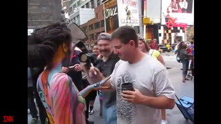 5. Andy Golub body paints model Tynisha Eaton in Times Square