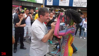 7. Andy Golub body paints model Tynisha Eaton in Times Square