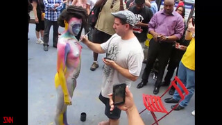 2. Andy Golub body paints model Tynisha Eaton in Times Square