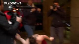 1. Topless FEMEN protester interrupts unveiling of Trump waxwork, Madrid