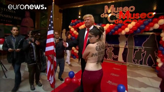 4. Topless FEMEN protester interrupts unveiling of Trump waxwork, Madrid