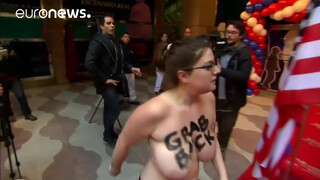 3. Topless FEMEN protester interrupts unveiling of Trump waxwork, Madrid