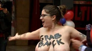 Topless FEMEN protester interrupts unveiling of Trump waxwork, Madrid