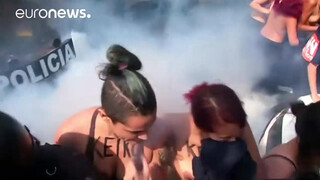 6. Topless protesters clash with police in Peru