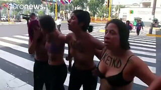 10. Topless protesters clash with police in Peru