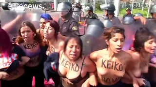 3. Topless protesters clash with police in Peru