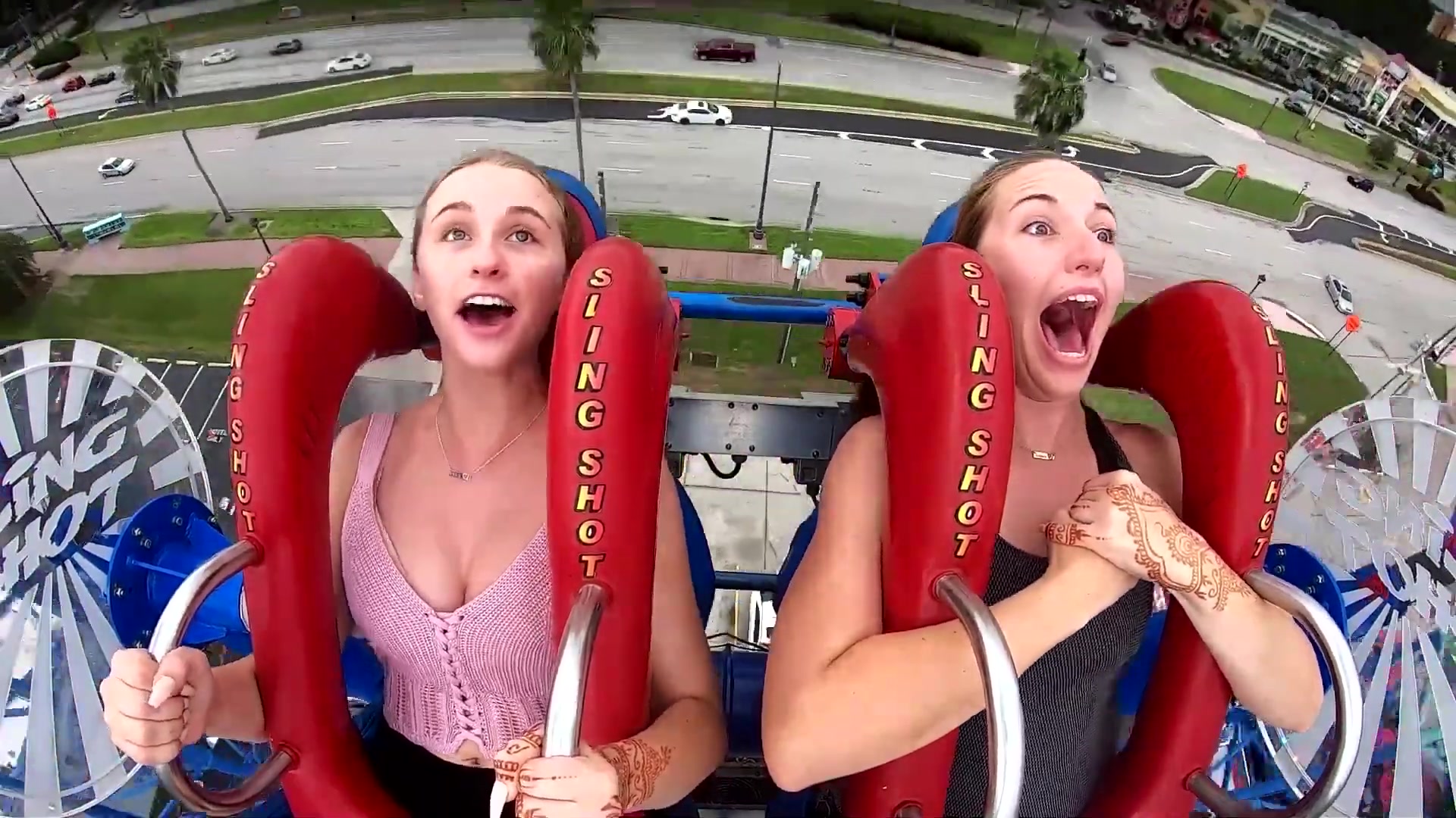 Boobs come out on sling shot ride